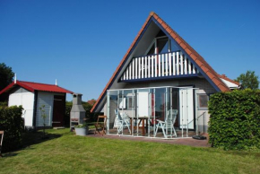 Gemütliches Ferienhaus mit Garten und einer Terrasse mit Windfang